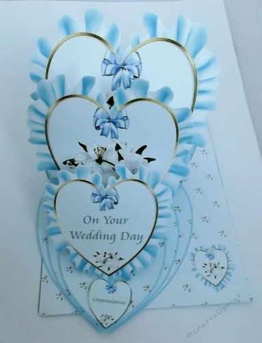 Blue wedding triple heart easel card and matching envelope.