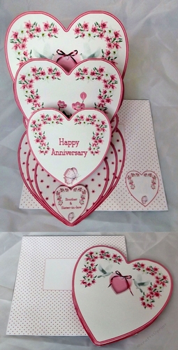 Pink and white triple heart easel anniversary card with matching envelope.