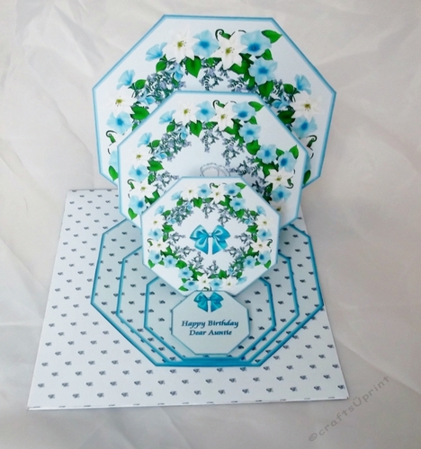 Blue floral octagonal triple easel card and matching envelope.