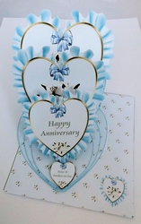 Blue anniversary triple heart easel card and matching envelope.