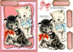 Two Adorable Kittens in There Bows.