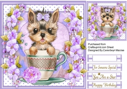 Beautiful Yorkie in a Teacup with lilac Blossom blossom