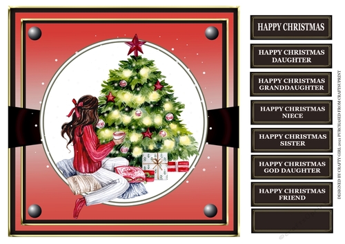 GIRL SITTING BY CHRISTMAS TREE