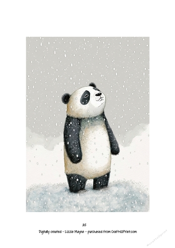 Panda bear looking up at the snow