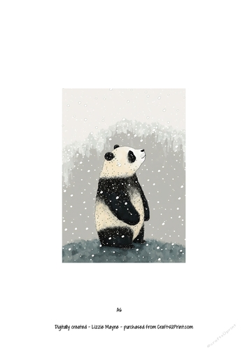 Panda bear looking up at the snow