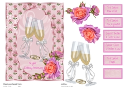 Wedding Anniversary card front with pink roses and champagne glasses