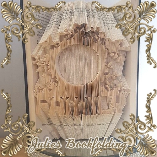 Ornate round family frame book folding pattern
