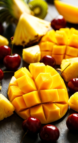 Tropical Fruit Medley – Mango, Pineapple, and Cherry Still Life