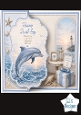 Coastal Dolphin Birthday Card Front – Ocean Sunset, Lighthouse & Seashell Design