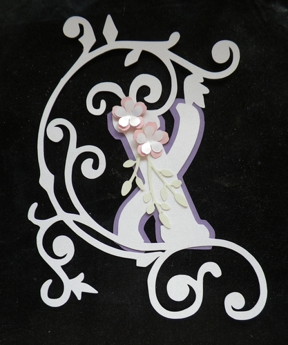 Embellished letter X