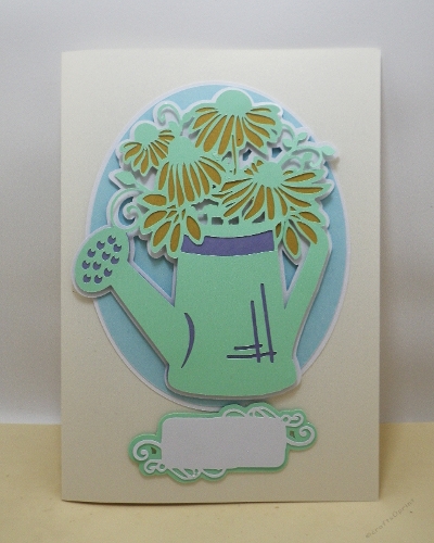 Watering can with flowers