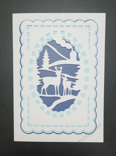 Snow scene with deer in oval topper