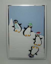 Tumbling penguins card topper