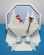 Octagonal easel card with snowman and bow
