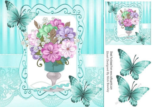pretty vase of mixed flowers in ornate frame with turq butterflies 8x8