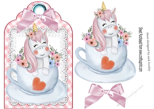 Cute unicorn in a teacup on lace with bow tag