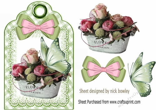 Pretty vintage roses with butterfly and bow on a tag