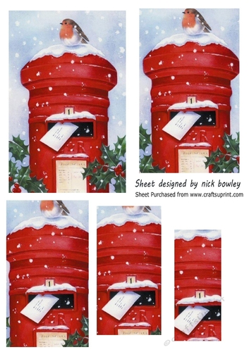Lovely Robin on a post box in the snow pyramids (one)