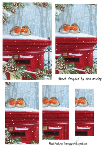 Lovely Robins on a post box in the snow pyramids (two)