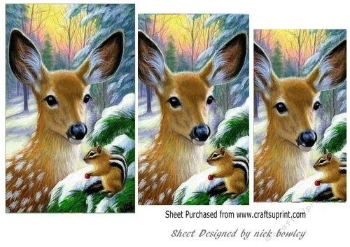 Pretty deer with a chipmunk in the snow pyramids