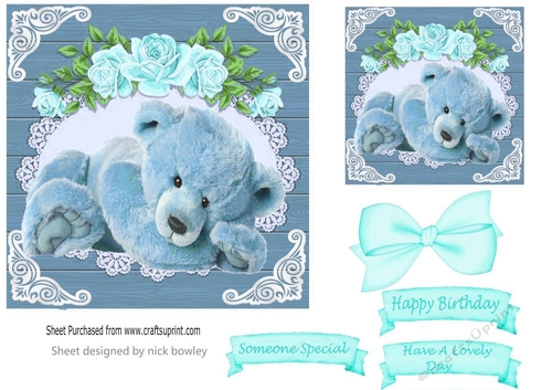 cute teddy with turq roses bow in a wooden frame 7x7