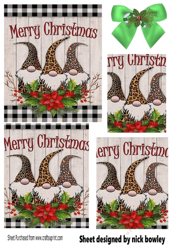 Three cheeky christmas gnomes with poinsettias pyramids