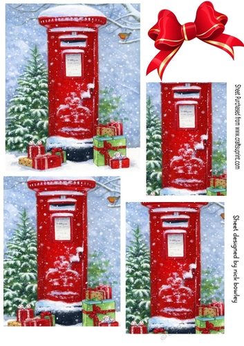 Lovely red post box in the snow with pyramids