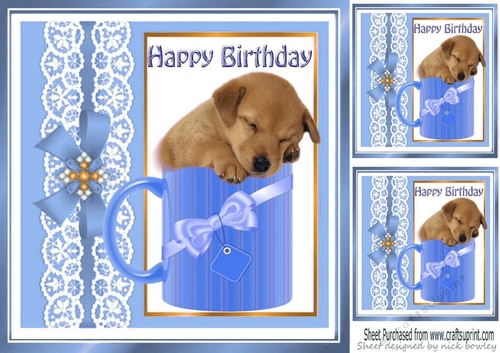 Cute little puppy sleeping in a mug with blue bow 8x8