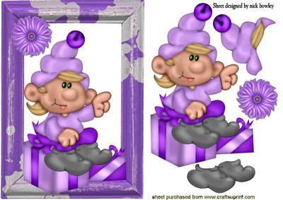 Santas Elf Sitting on a Present in Wooden Frame