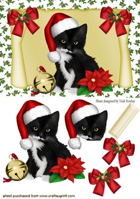 Little Black Kitten on a Scroll in Santa Hat