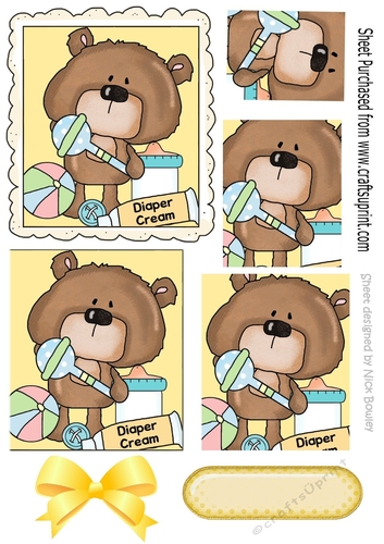 Cute teddy, with diaper cream and rattlel with bow pyramids