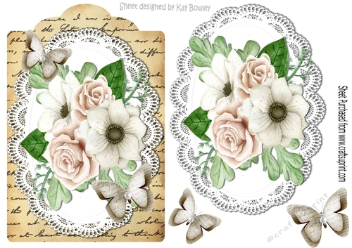 Cream roses and paper butterflies on script topper & lace