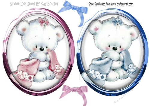 cute cuddly bears in pink and blue toppers with glass and bows