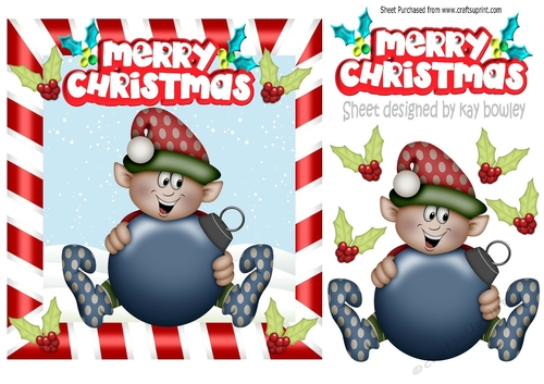 christmas elf with bauble and holly inthe snow
