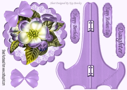 Pretty purple flower on lace with  bow, plate and stand