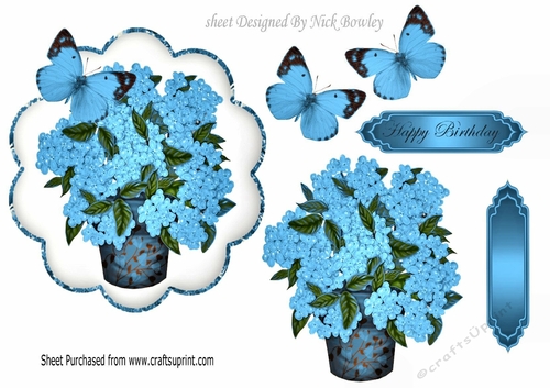 Pretty blue Hydrangeas in a vase with pretty blue butterflies