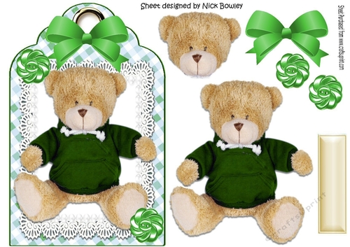 Lovely teddy in a green jumper on lace with bow 