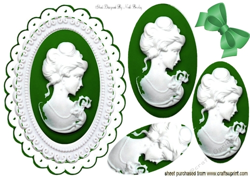 pretty white cameo with leaf green frame & oval pyramids