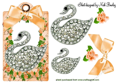pretty diamond swan with peach roses & bow on a tag