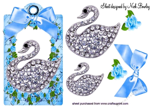 pretty diamond swan with blue roses & bow on a tag