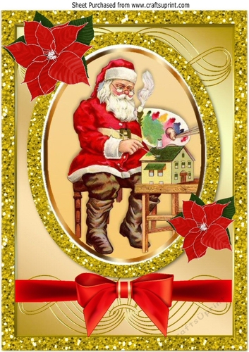 Santa in his workshop with bow and holly In gold glitter frame  A4