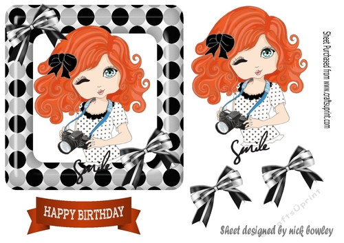 Smile for the camara cute little girl red hair in polkadot frame