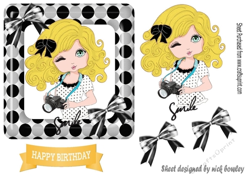 Smile for the camara cute little girl blond hair in polkadot frame