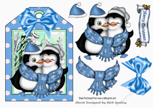 Lovely cuddle penguins with spot tag and blue bow topper