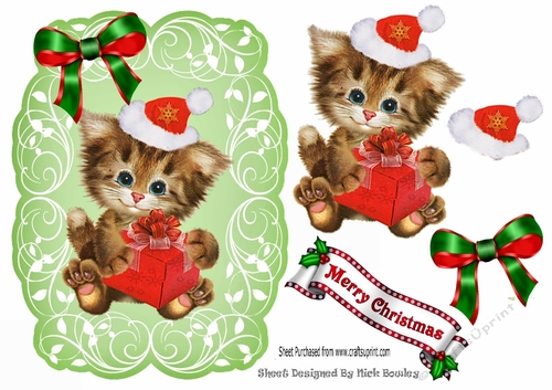 Cute kitten in santa hat on leaf topper with red bow