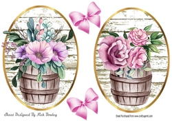 Two pretty flowers in barrel toppers with bows