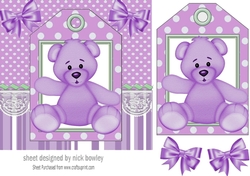 Cute purple teddy on a tag topper with bows