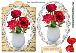 red roses in a vase roses on a script tag with bow