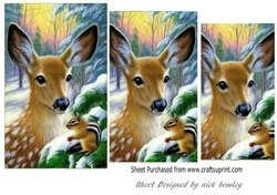 Pretty deer with a chipmunk in the snow pyramids