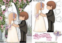 Lovely Wedding Couple with Doves in a Rose Garden